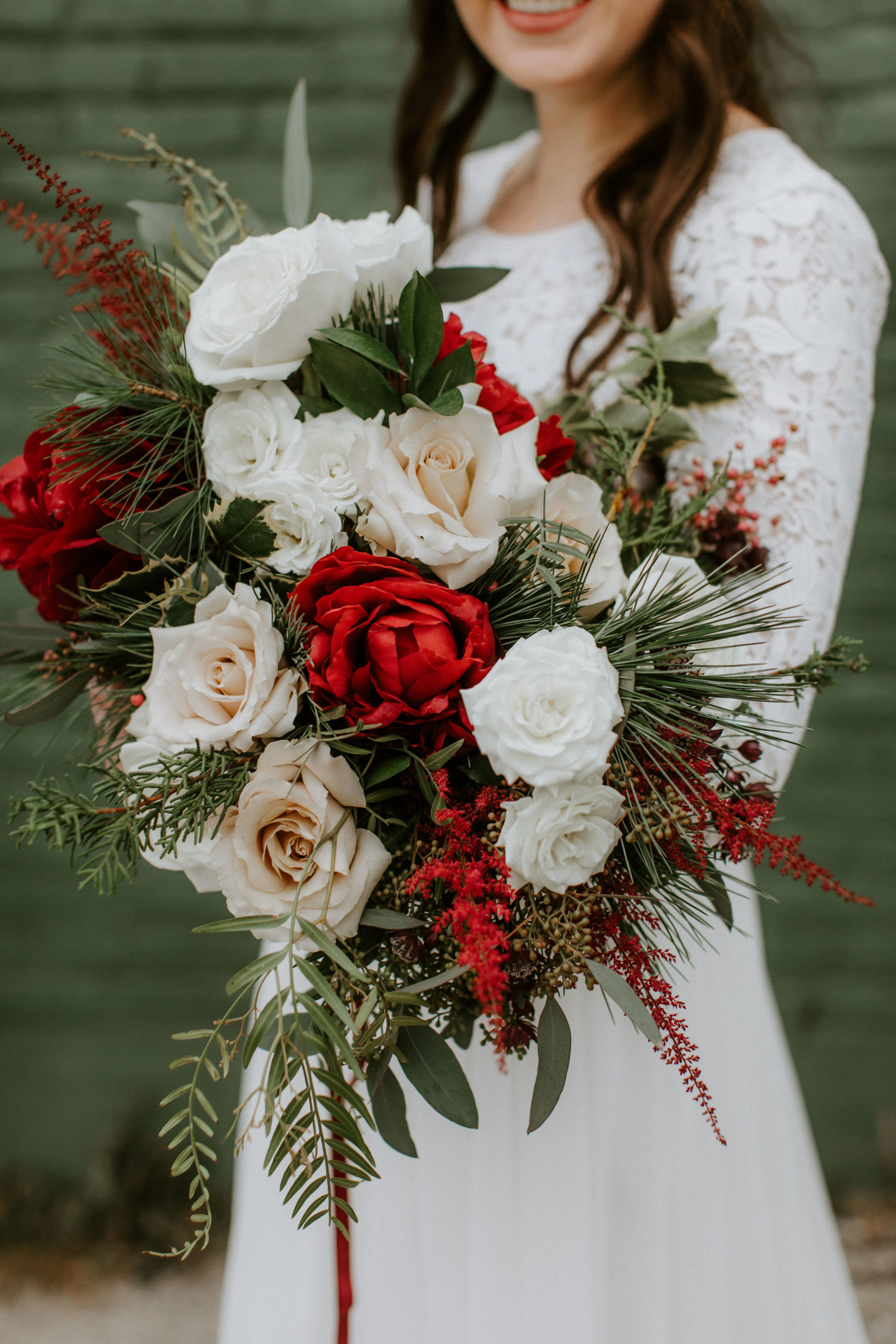 Hannah & Hayden's Winter Wedding at The Ivy House. Deep burgundy hues, winter whites, and an evergreen ceremony backdrop brought together Hannah & Hayden's Winter Wedding at The Ivy House...