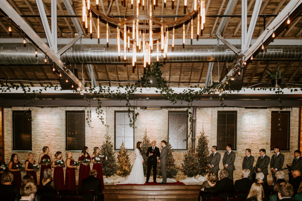 Hannah & Hayden's Winter Wedding at The Ivy House. Deep burgundy hues, winter whites, and an evergreen ceremony backdrop brought together Hannah & Hayden's Winter Wedding at The Ivy House...